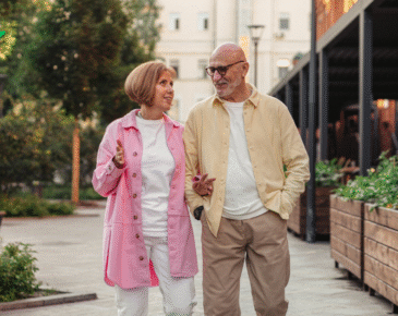 Senior couple walking along path