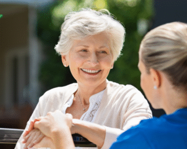 Senior woman with nurse outside