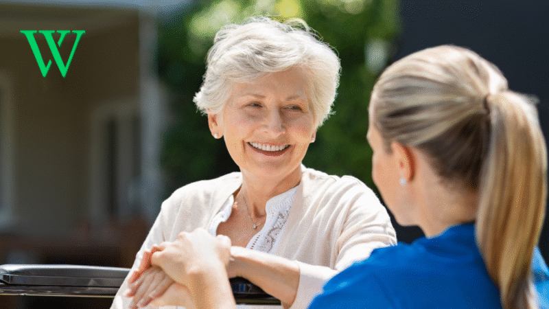 Senior woman with nurse outside