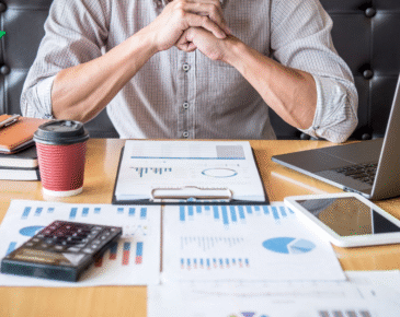 Man at table reviewing his investment plan